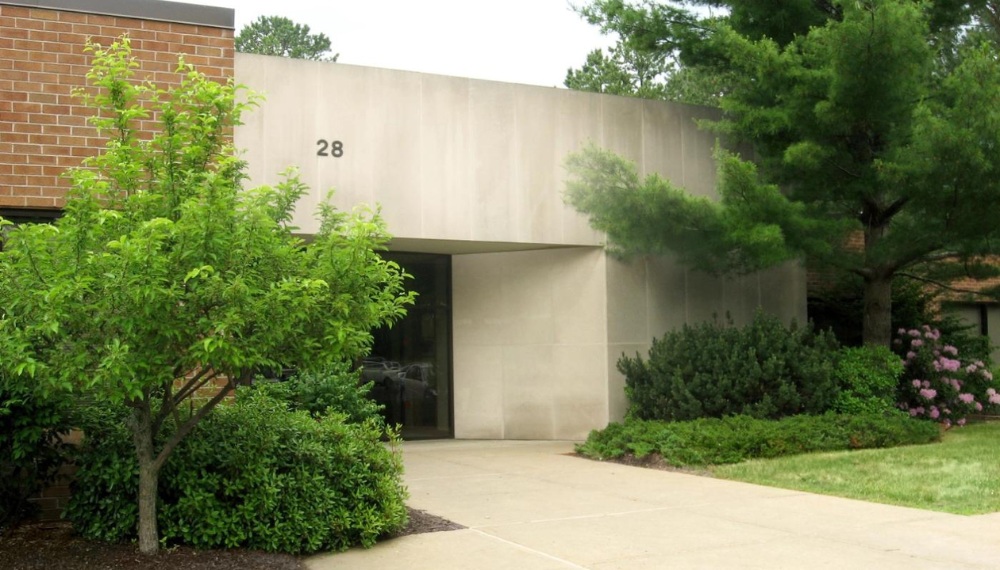 Entrance to office building 28 Madison Ave Extension, rented by Delaware Engineering, a tenant of The Anderson Group